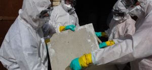 a photo of asbestos being removed carefully